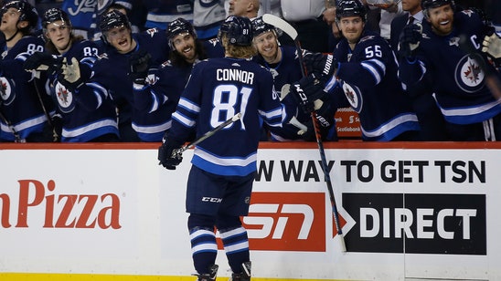 Connor’s hat trick helps Jets top Preds, clinch playoff spot