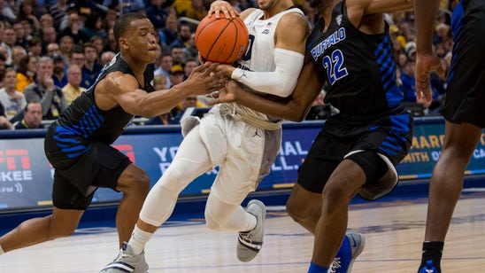 Howard scores 45, lifts No. 20 Marquette past No. 14 Buffalo