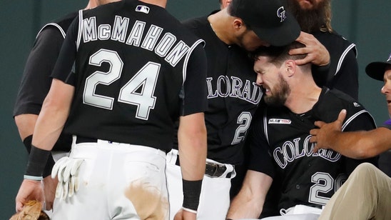 Dahl carted off after ankle injury, Rockies beat Giants 5-4