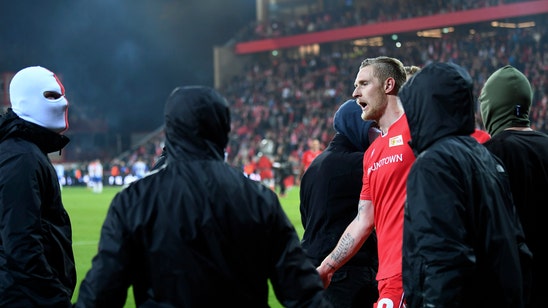 Union Berlin fans celebrate goalkeeper for stopping ultras