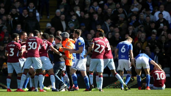 Aston Villa player attacked by fan in derby at Birmingham