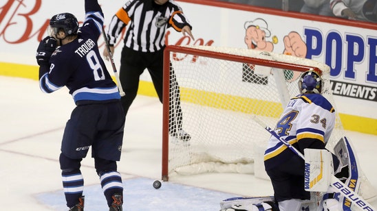 Trouba scores in OT to lift Jets over Blues 5-4