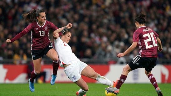 English women attract record crowd but lose to Germany