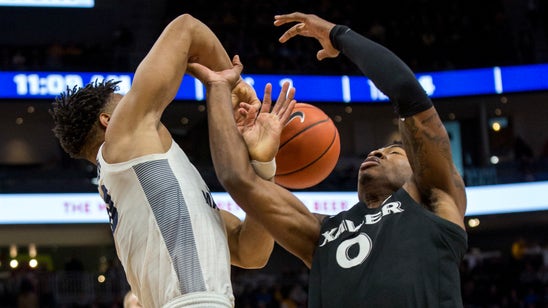 Howard helps No. 16 Marquette past Xavier 70-52