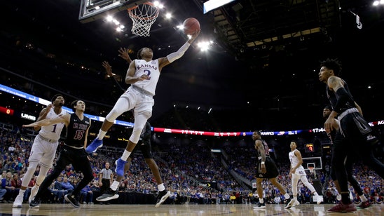 Lawson leads No. 2 Kansas past New Mexico State 63-60