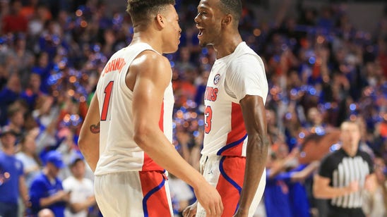 Lewis helps No. 15 Florida to tight win over Towson