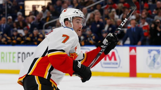 Lindholm scores in OT, Flames beat Sabres 3-2