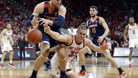 No. 3 Virginia survives, beats No. 23 NC State 66-65 in OT