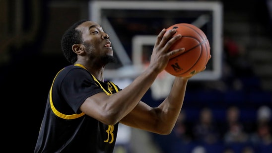 Navy squeezes past East Carolina 62-57 in Veterans Classic