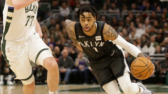 Russell leads Nets past Bucks 133-128