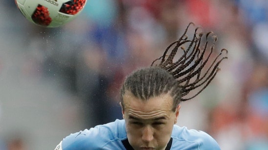 AC Milan signs Uruguay midfielder Laxalt on deadline day