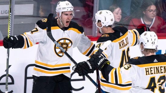 Moore’s late power-play goal lifts Bruins past Canadiens