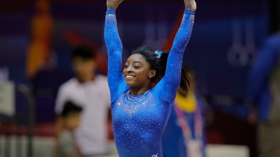 Biles fights through kidney stone at world championships