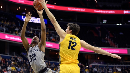 No. 15 Marquette survives Georgetown despite Howard’s injury