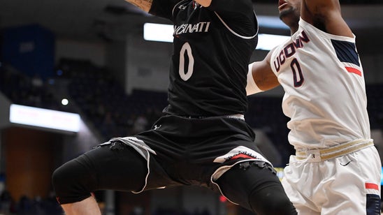 Cincinnati holds off UConn 64-60 to keep pace in AAC race