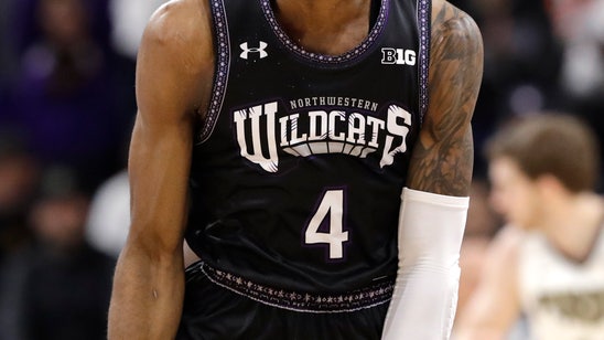 Northwestern's Law carried off court with leg injury