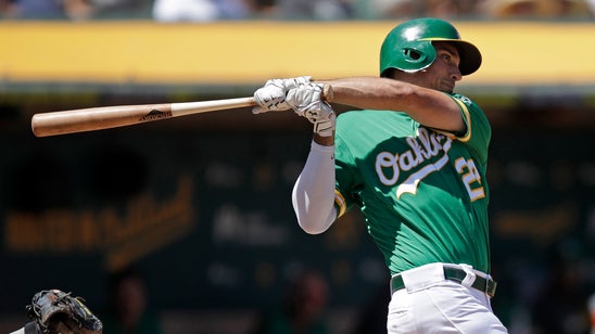 Chapman, Canha back Bassitt in A's 8-4 win over Astros
