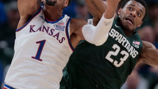 No. 1 Kansas holds off No. 10 Michigan State 92-87 in opener