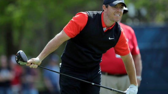 The Latest: McIlroy needs rally and stumbles at start