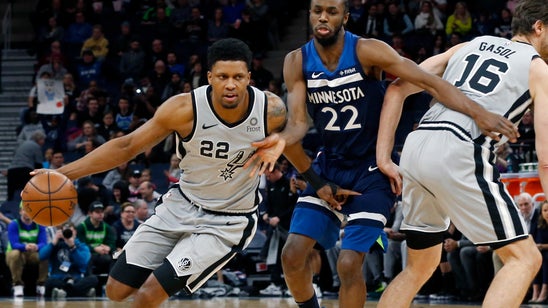 Popovich ties Riley for road wins; Spurs beat Wolves 116-113