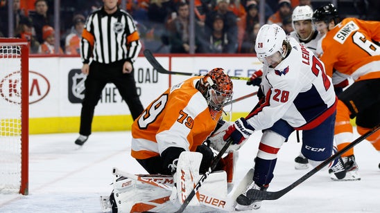 NHL-leading Caps top Flyers 2-1 in SO to extend point streak