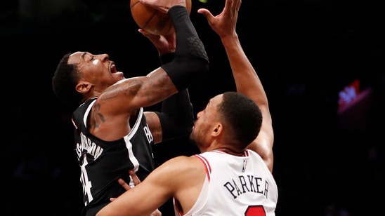 Russell scores 30, Nets beat Bulls for 9th straight at home