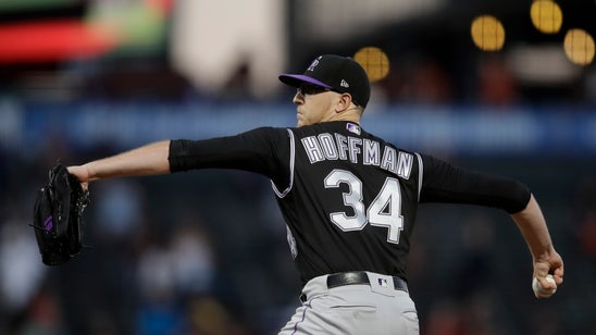 Rockies RH Hoffman carted off field after line drive to knee