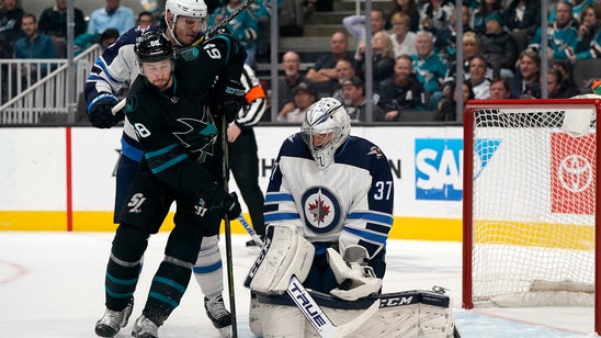 Hellebuyck's 51 saves lead Jets past Sharks 3-2