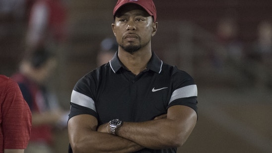 Tiger Woods poses as Mac Daddy Santa for his kids