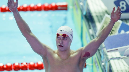 Ledecky stunned in 400 free at worlds; Sun wins record title