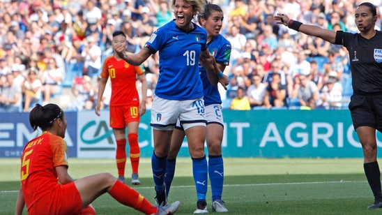 Italy beats China 2-0, reaches first quarterfinal since 1991