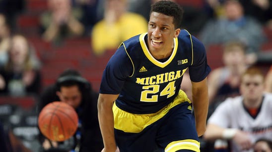 Michigan's Dawkins transferring to play for father at UCF