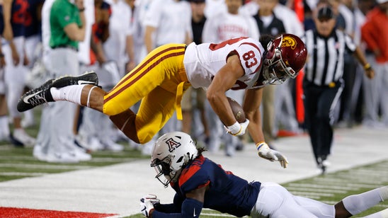Ware runs for 2 TDs, USC holds off Arizona 24-20