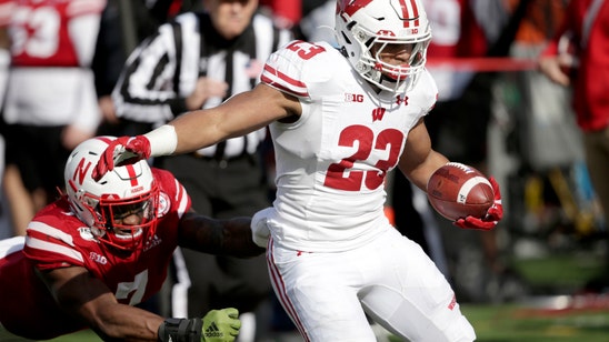 Taylor over 200 again in No. 15 Badgers’ 37-21 win over Neb