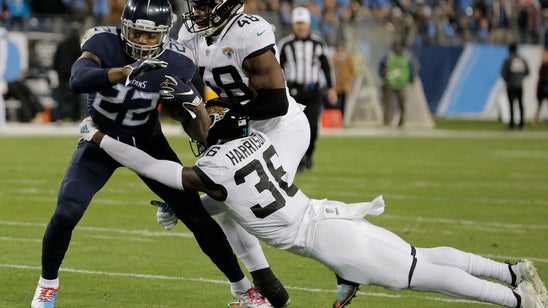 Henry runs into NFL record book as Titans rout Jaguars 30-9