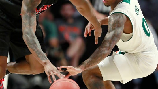 Johnson’s 20 helps No. 18 NC State rally past Miami 87-82