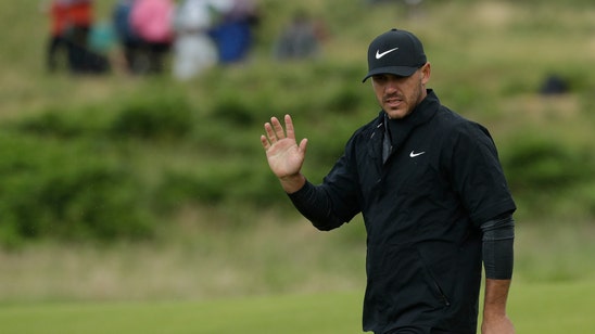 The Latest: McIlroy makes a late charge with 65
