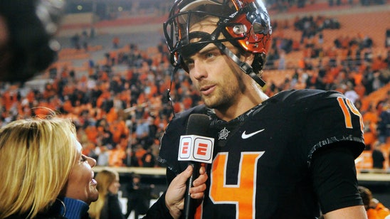 Cornelius leads Oklahoma St. past No. 7 West Virginia, 45-41