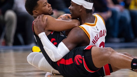 Holiday hits key shots in Pacers' OT home win over Raptors