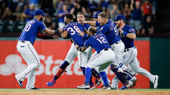 Rangers rally from 4 down to beat Astros 9-8 on Santana hit