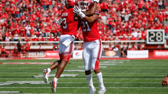 Huntley leads No. 13 Utah past Northern Illinois 35-17
