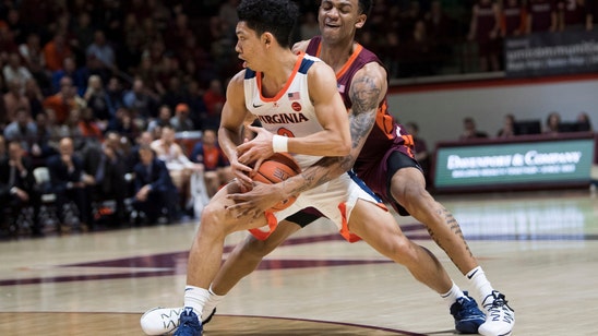 Guy’s 23 lift No. 3 Virginia past No. 20 Hokies, 64-58