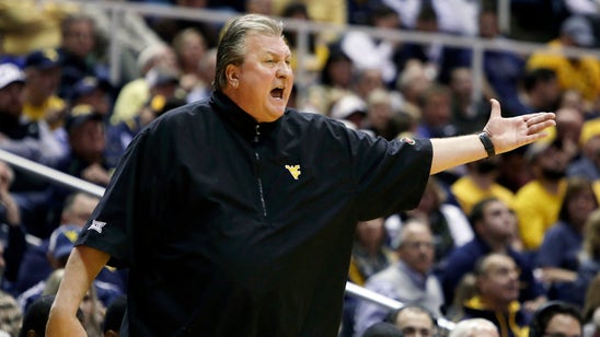 West Virginia coach Bob Huggins says defibrillator led to health scare