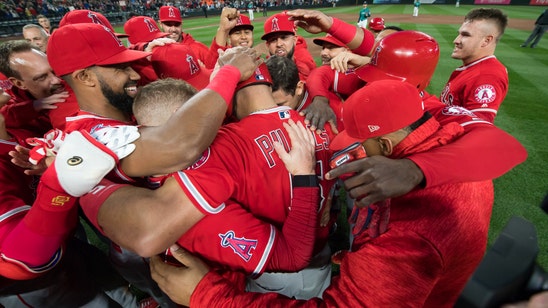 PHOTOS: Albert Pujols hits No. 3,000 and celebrates with teammates