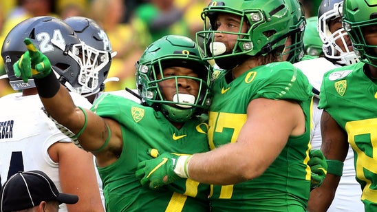 Herbert throws 5 TDs and No. 16 Oregon routs Nevada 77-6