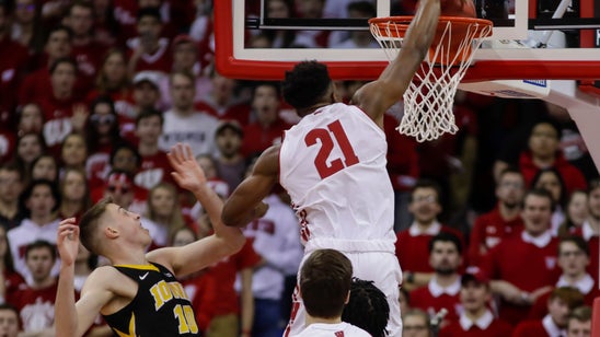 No. 21 Wisconsin routs Iowa 65-45