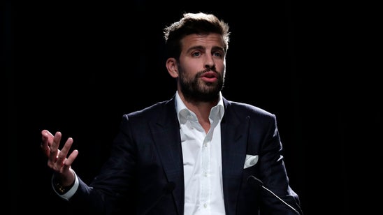 Gerard Pique juggles business with soccer at Barcelona