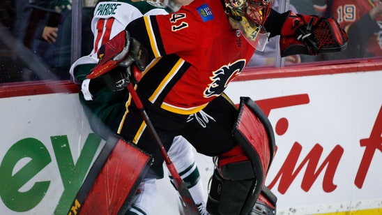 Smith has 31 saves, Lindholm scores 2 as Flames top Wild 2-0