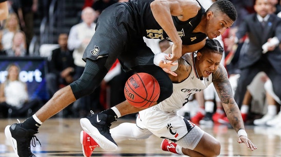 Jenifer’s late shots rally Cincinnati over UCF 60-55