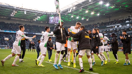 Frankfurt captain sent off for knocking over Freiburg coach